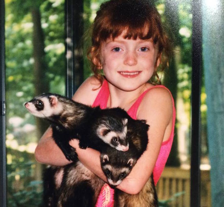 Nicki's love for animals started early - here she is holding ferrets when she was little.