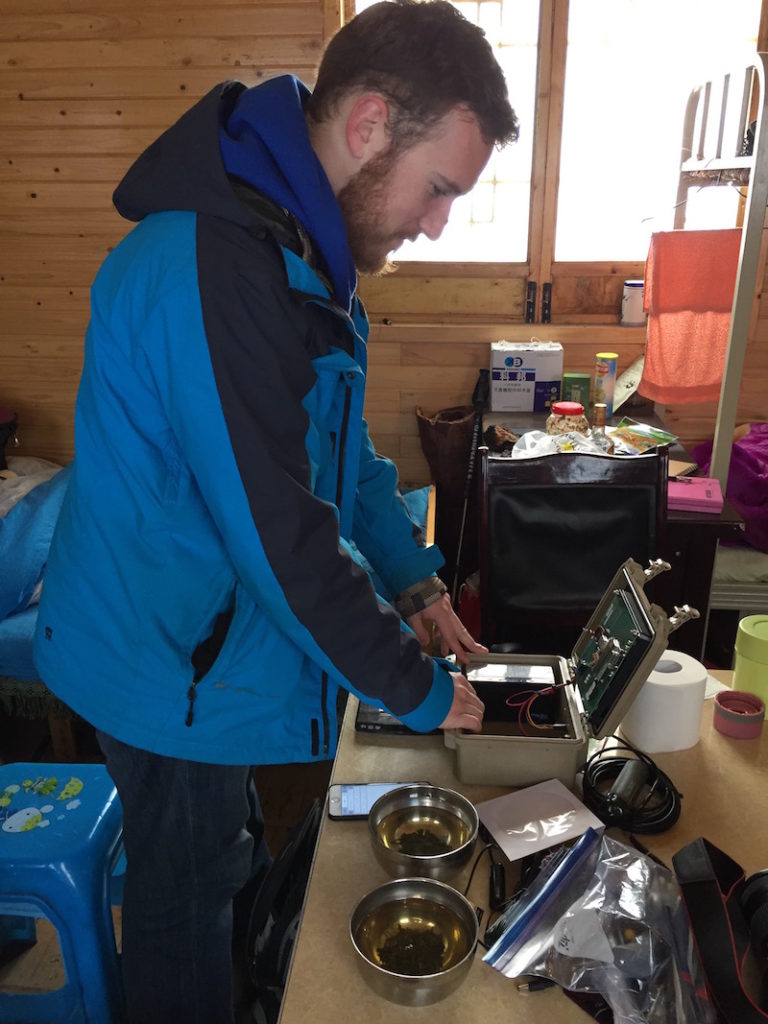 Zachary David setting up and testing our camera trap equipment